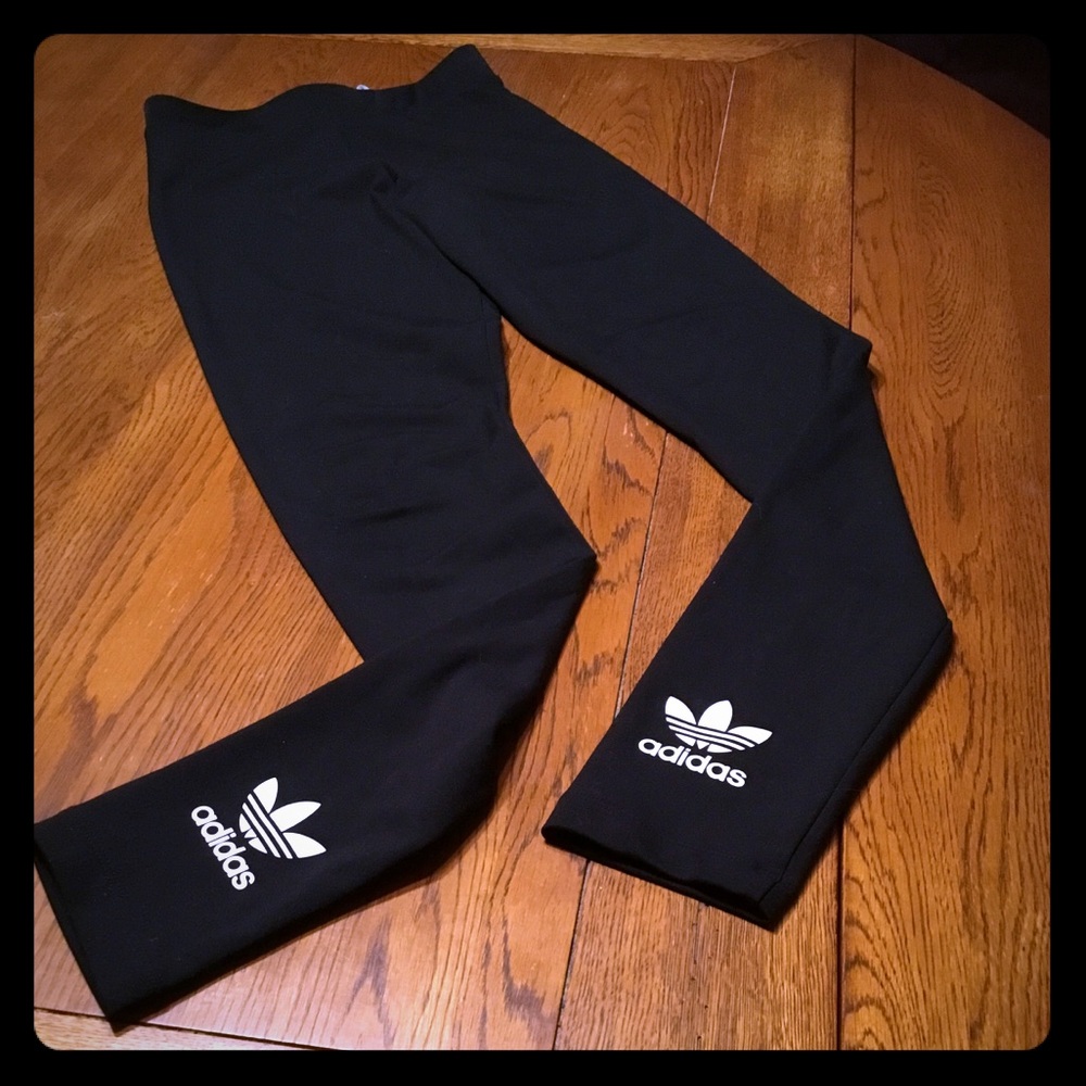Adidas legging with logo on back side of leggings